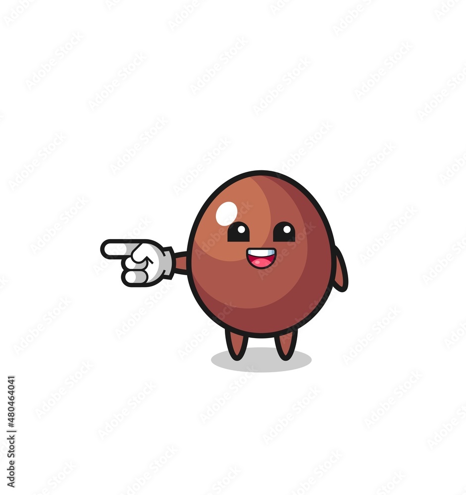 chocolate egg cartoon with pointing left gesture chocolate egg cartoon with pointing left gesture
