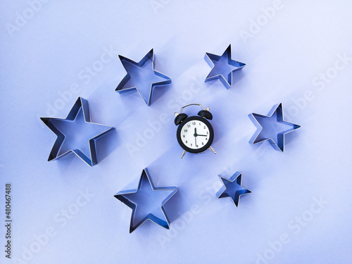 The concept of sleep. Night sky with purple background, stars and alarm clock Free Download The concept of sleep. Night sky with purple background, stars and alarm clock - GFXLoad