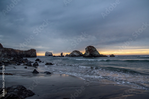 Ocean Sunset Through Rocks Along California Coast on Pacific Highway One