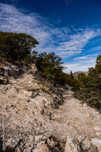 Hiker Heading Down Switchback In Guadalupe Mountains