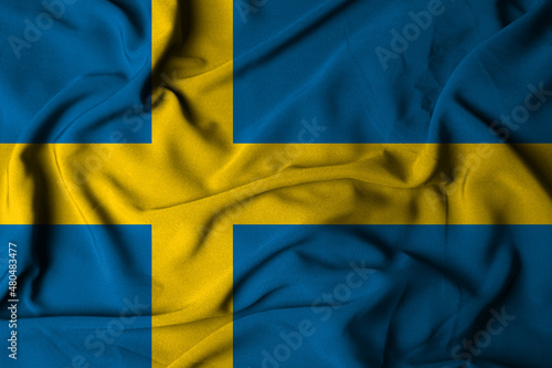 selective focus of swedish flag with waving fabric texture. 3d illustration