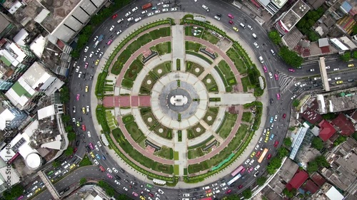 Top down aerial view of traffic around huge roundabout during rush hour in Bangkok, Thailand.