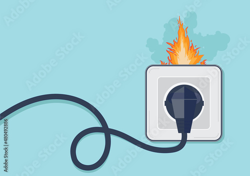 Electrical outlet with plug on fire.