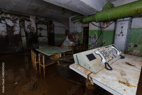 abandoned rotten shelter underground with equipment
