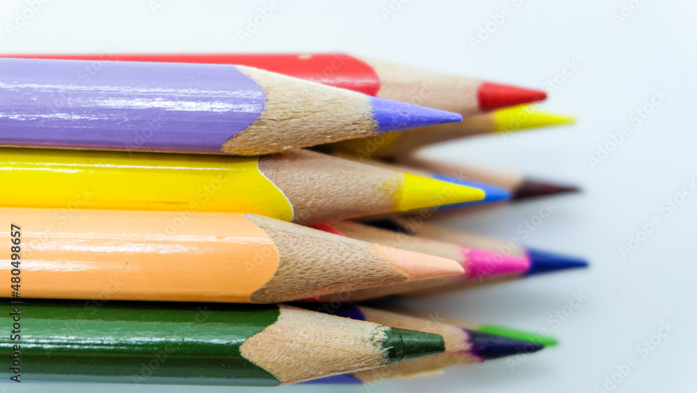 Naklejka premium Color pencils on white background. Isolated close up shot.&nbsp; 