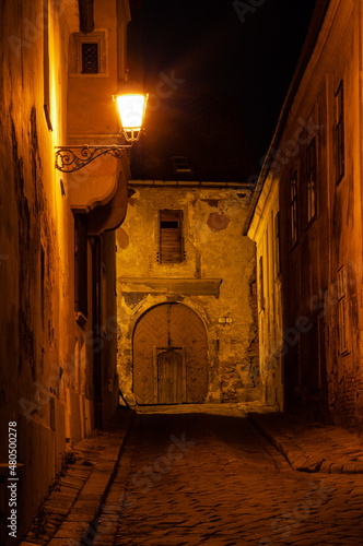 Old dark alley at night in Bratislava, Slovakia