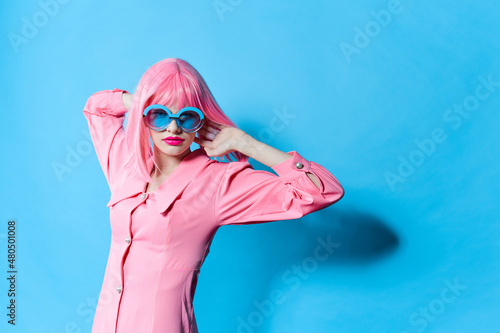 fashionable woman in pink wig pink dress Red lips isolated background