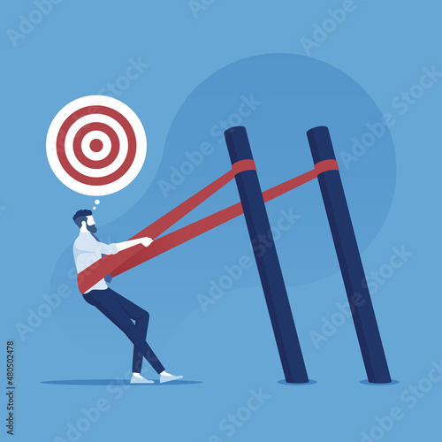 Canvas Businessman in a slingshot ready to launch to target, business success concept