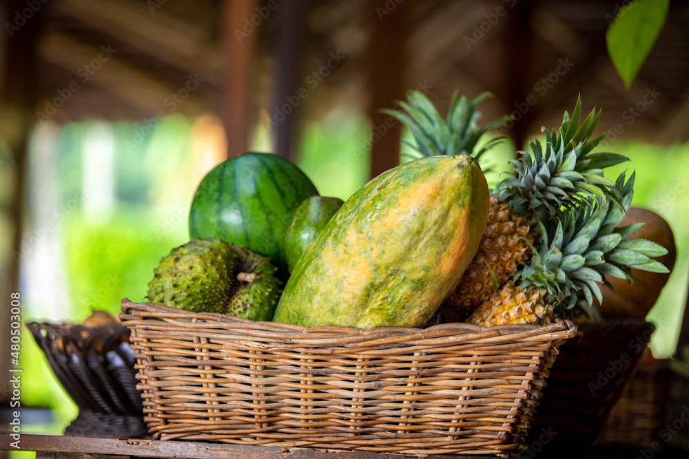 papaya, pineapple and other fruits on the basket