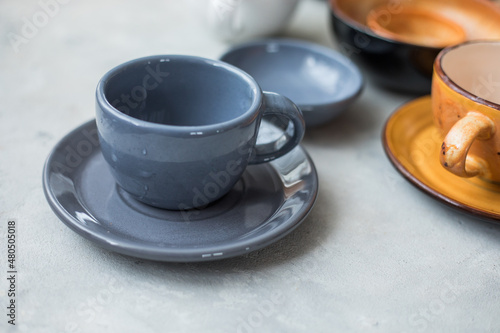 empty  ceramic   cup on white table, utensils