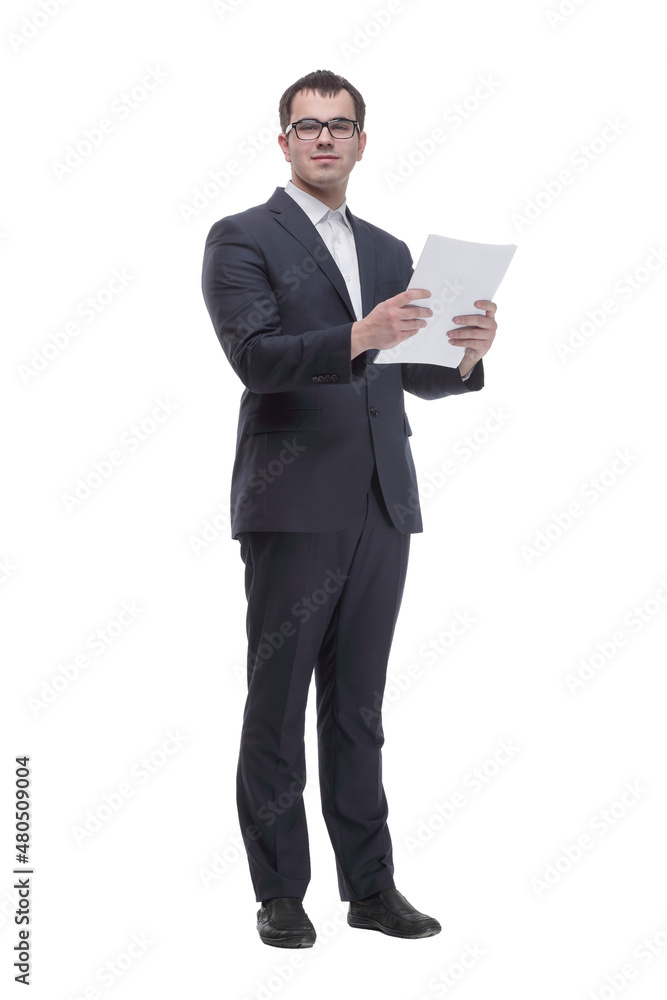 Business man in glasses and formalwear is readin a document while standing against a white background