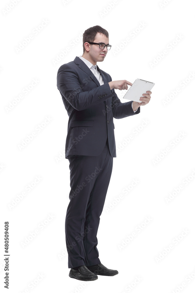 Side view portrait of curious and smiling businessman with tablet looking and pointing to side Side view portrait of curious and smiling businessman with tablet looking and pointing to side