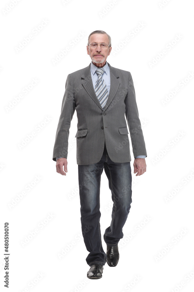 full length picture of a mid aged business man walking towards the camera and smiling. full length picture of a mid aged business man walking towards the camera and smiling.