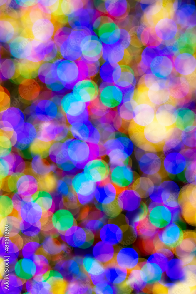 Bright beautiful multicolored bokeh background. Abstract background with flickering lights with unfocused light.