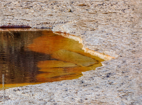 Salt flakes drying on the surface of salt ponds at Bedwell Bayfront Park in Menlo Park, California photo