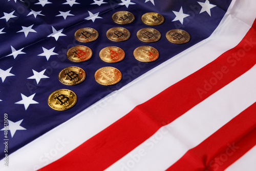 Wallpaper Mural The concept of the economic crisis. Bitcoin gold coins lie on the American flag. Beautiful photo images of gold Bitcoin coins. Cryptocurrency with images of the American flag. Coins close-up. Torontodigital.ca