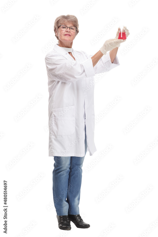 Mature woman doctor in medical suit holding beaker Mature woman doctor in medical suit holding beaker