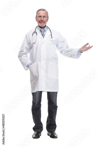 Cheerful mature doctor looking at camera and pointing away