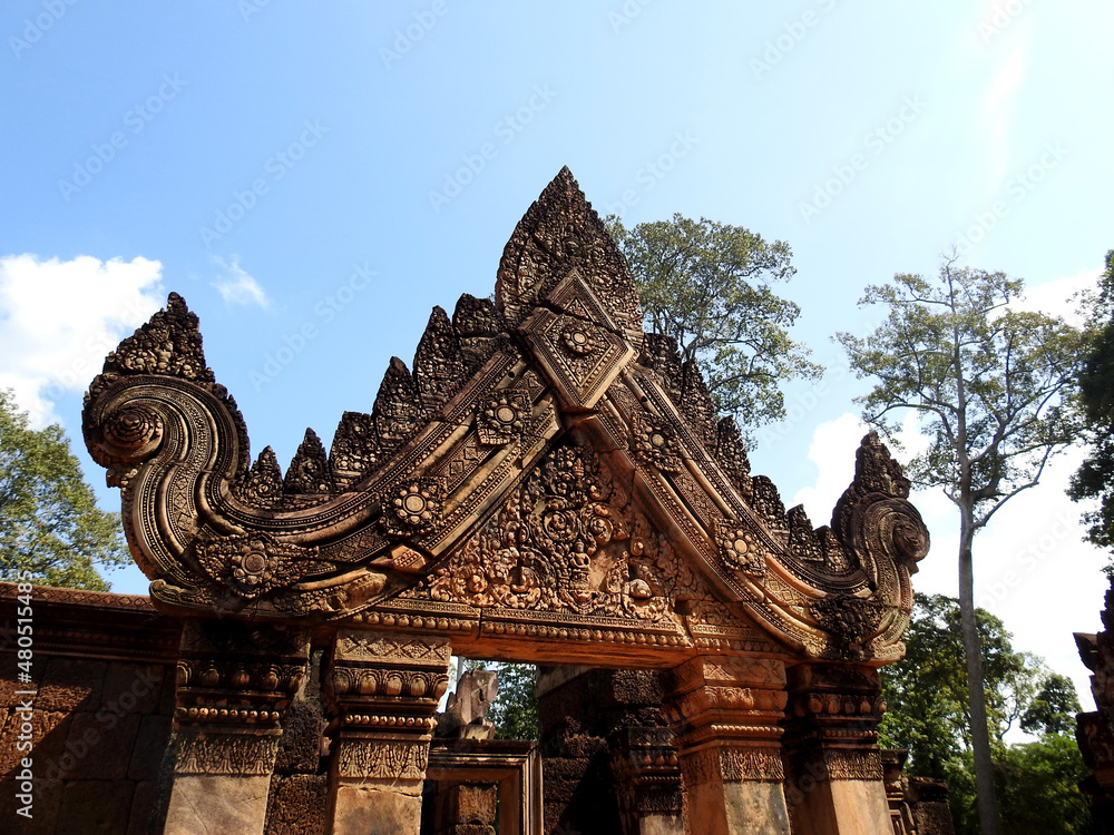 Fototapeta premium Banteay Srey is a 10th-century Cambodian temple dedicated to the Hindu god Shiva. Located in the area of Angkor, it lies near the hill of Phnom Dei. 