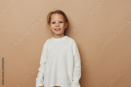cute girl in white sweater posing hand gestures isolated background