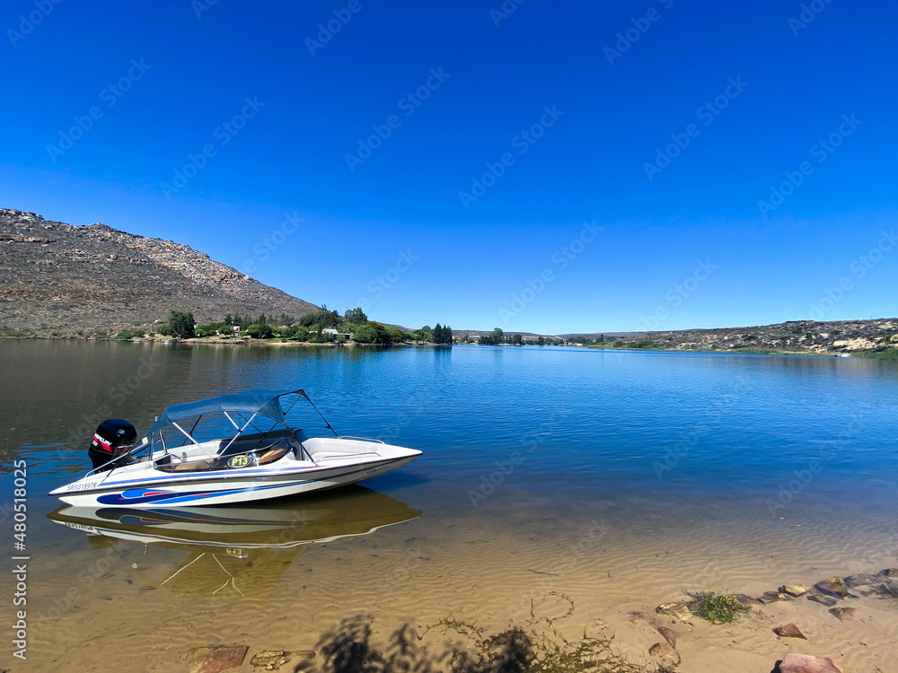 Speedboat on Bulshoek Dam on a summer's day. Fun, adventure, summer, holiday concepts.