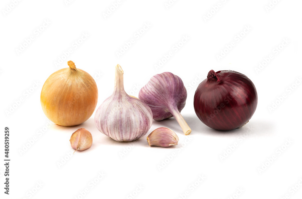 A mixture of fresh garlic, red and yellow onions on a white background. A mixture of fresh garlic, red and yellow onions on a white background.