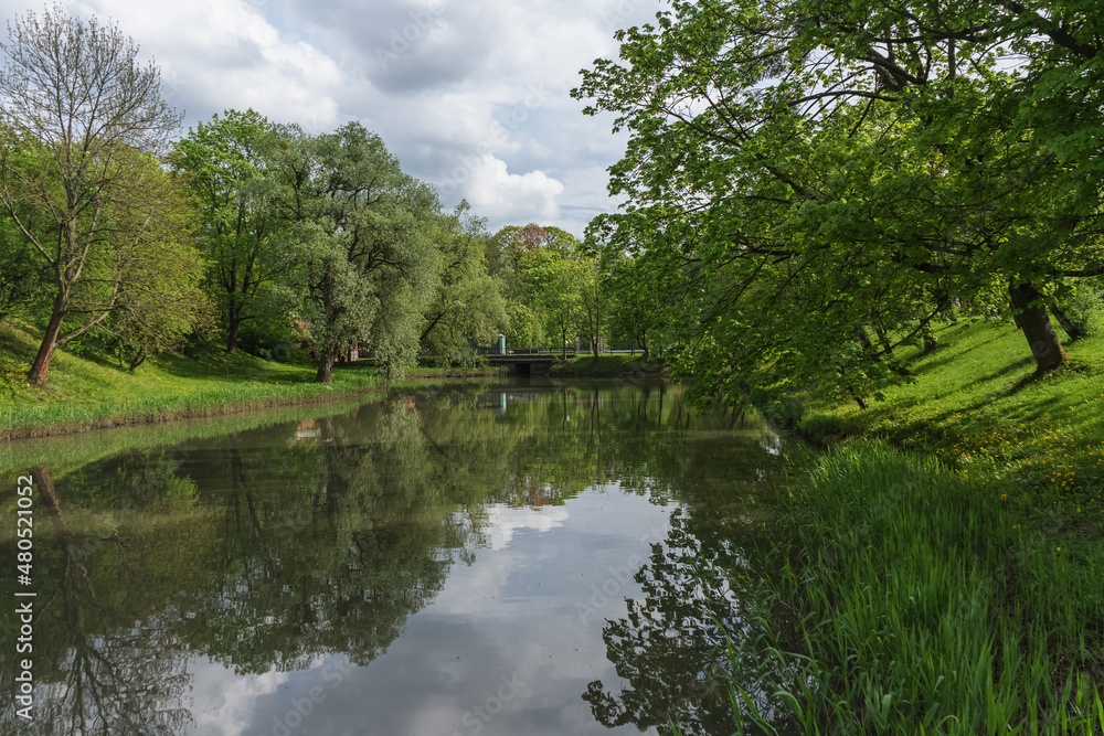 beauty of spring park with bridge and pond view beauty of spring park with bridge and pond view