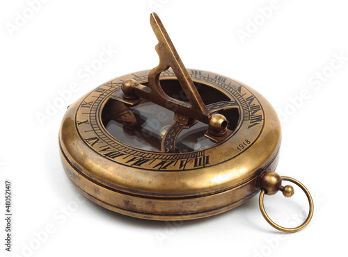 Old vintage compass with sundial on a white background.  photo