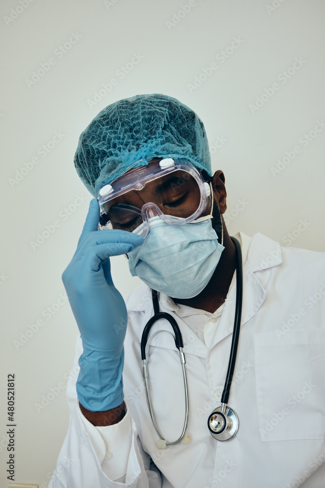 Tired Male Surgeon Wearing Protection Tired Male Surgeon Wearing Protection
