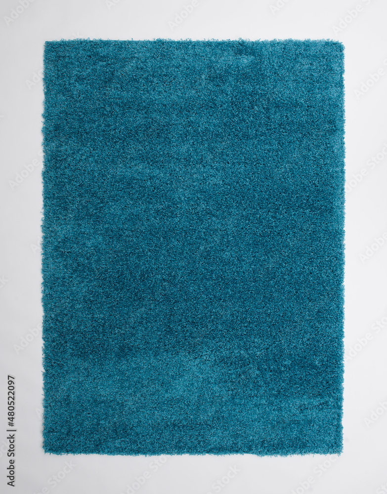 A blue carpet laid on the floor. A blue carpet laid on the floor.