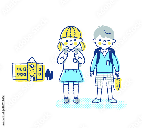 小学生の男女と学校