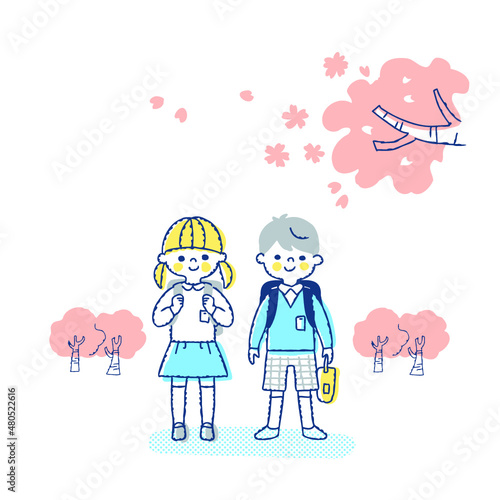 小学生の男女と桜