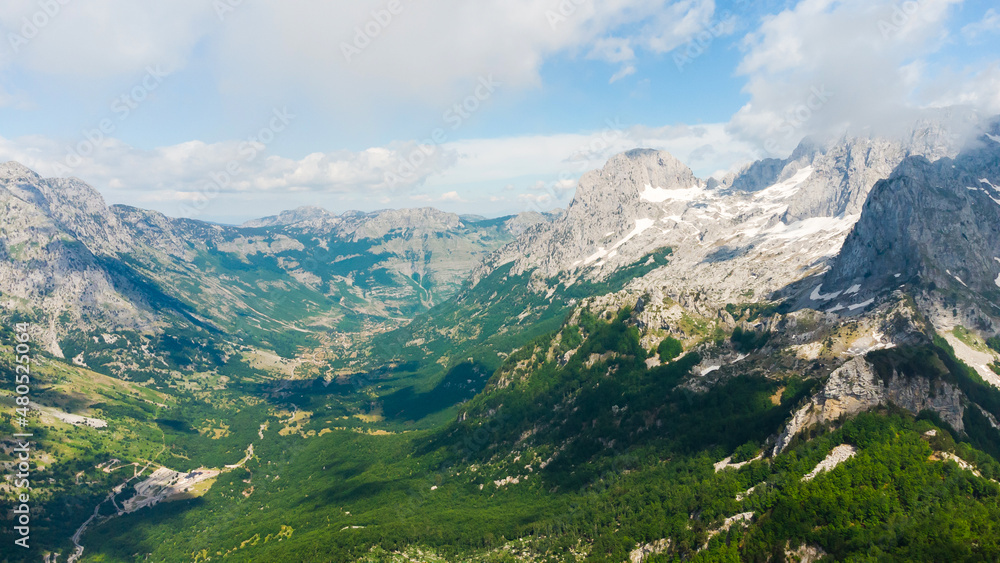 Naklejka premium Spring morning at mountains and clouds