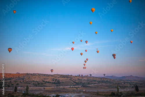 GOREME, TURKEY - SEPTEMBER 18. 2021: Bright hot air balloons in sky of Cappadocia, Turkey