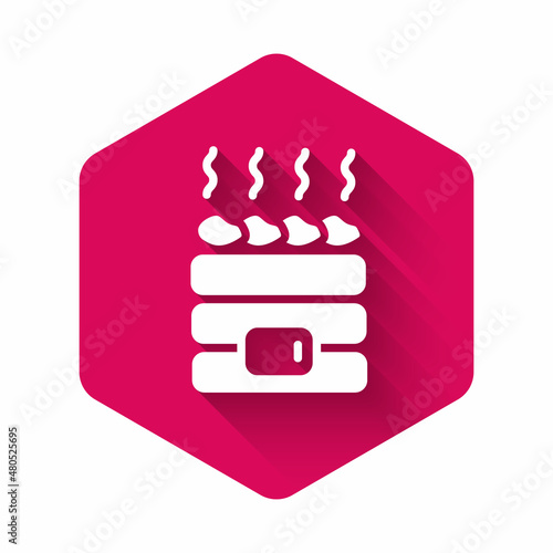 White Hot sauna stones icon isolated with long shadow background. Spa resort recreation, bathhouse relaxation. Hot stones on electric heater. Pink hexagon button. Vector