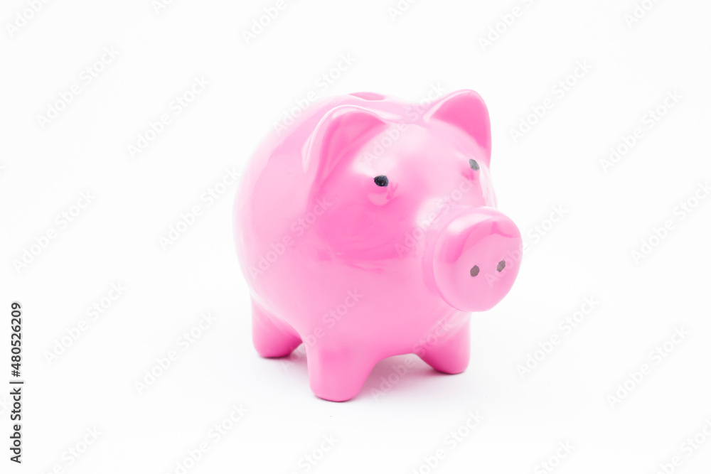 Pink piggy bank on isolated white background.