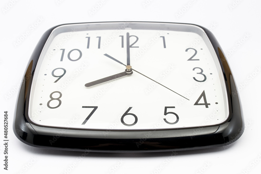 Black classic clock on isolated white background. Black classic clock on isolated white background.