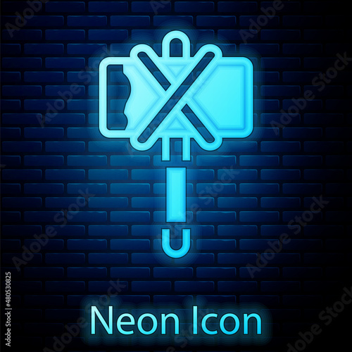 Glowing neon Medieval axe icon isolated on brick wall background. Battle axe, executioner axe. Medieval weapon. Vector