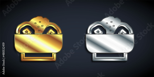Gold and silver Chow mein on plate icon isolated on black background. Asian food. Long shadow style. Vector