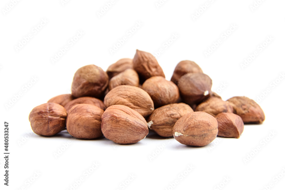 Raw shelled hezelnuts or filberts isolated on white Raw shelled hezelnuts or filberts isolated on white