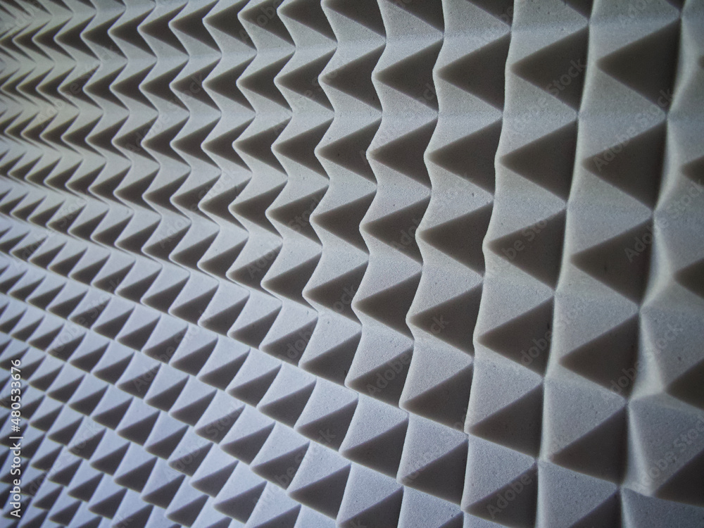 Grey acoustic foam rubber. Soundproof pyramids, full frame. Grey acoustic foam rubber. Soundproof pyramids, full frame.