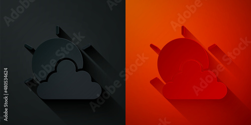 Paper cut Sun and cloud weather icon isolated on black and red background. Paper art style. Vector