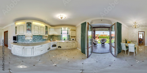 Foto 360 hdr panorama in interior of kitchen with served table in country house with
