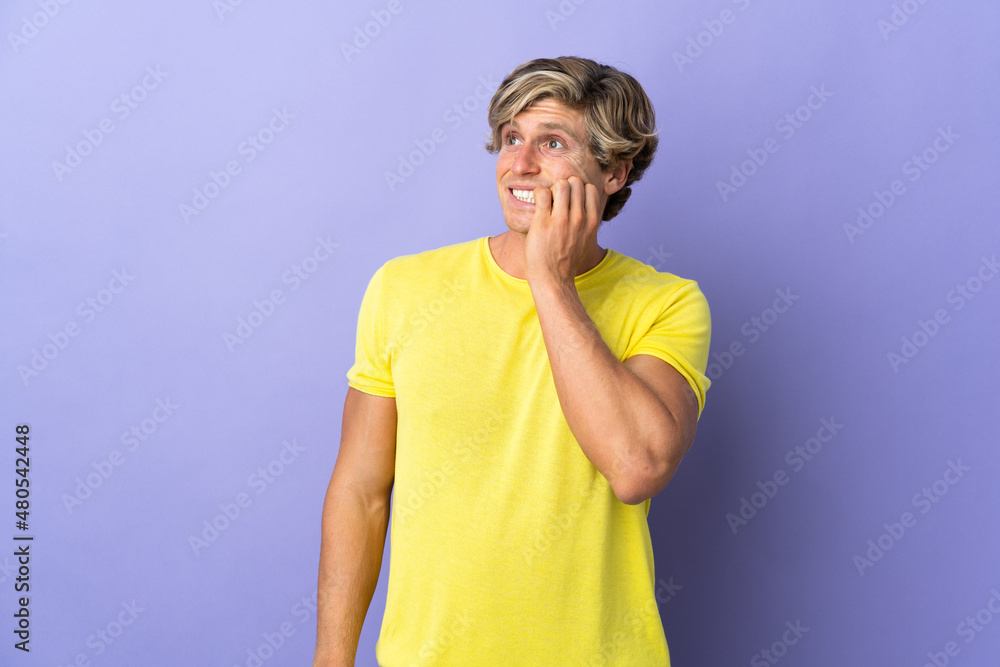 English man over isolated purple background is a little bit nervous English man over isolated purple background is a little bit nervous