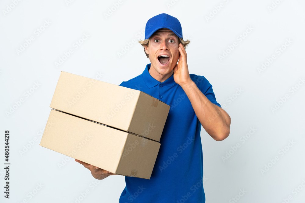 Delivery man over isolated white background with surprise and shocked facial expression Delivery man over isolated white background with surprise and shocked facial expression