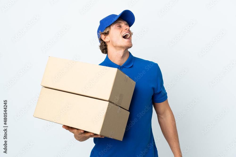 Delivery man over isolated white background laughing Delivery man over isolated white background laughing