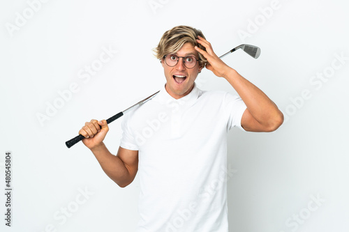English man playing golf with surprise expression