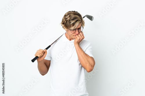 English man playing golf having doubts