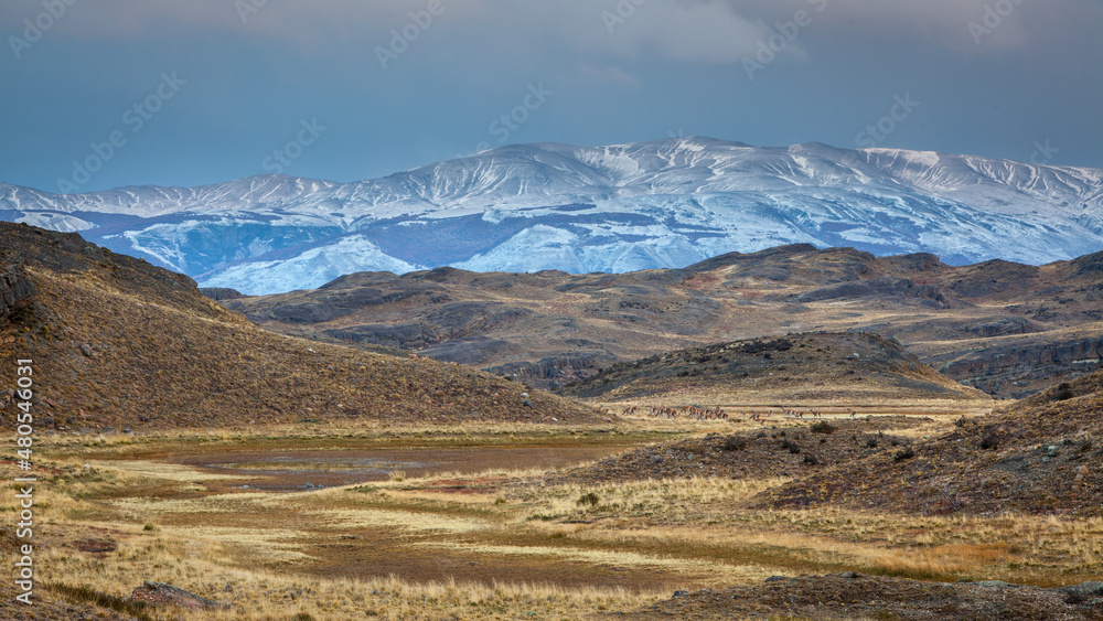 Winter landscape in Patagonia: hills in Torres del Paine National Park with a thin layer of freshly fallen snow
