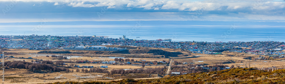 Fototapeta premium Panoramic view on the city of Punta Arenas with the Strait of Magellan and Tierra del Fuego in the background